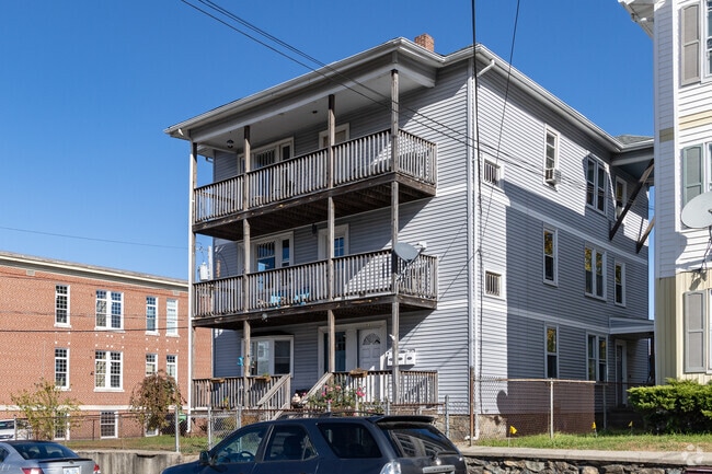 A classic triple decker style multifamily found in Fairmount.