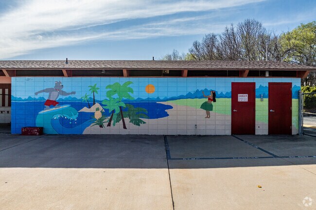Center Creek Park includes a Carl Junction public pool with its brightly painted mural.