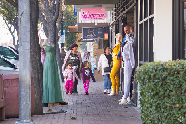 A mother and her two daughters shop the Downtown Delano boutiques.