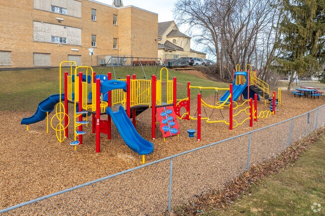 Children can play on the playground equipment at St. Peter Elementary School in Slinger, WI.