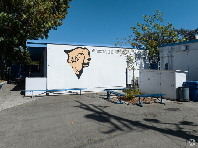 Kids relax in the Cheviot Hills Continuation School outdoor space in Palms, Los Angeles.