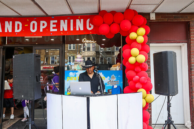 Entertainment for a Grand Opening livens up the Orange shopping area.