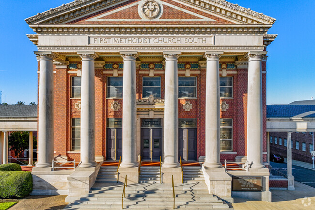 The facade of the First Methodist Church South shows the intricate historical architecture.