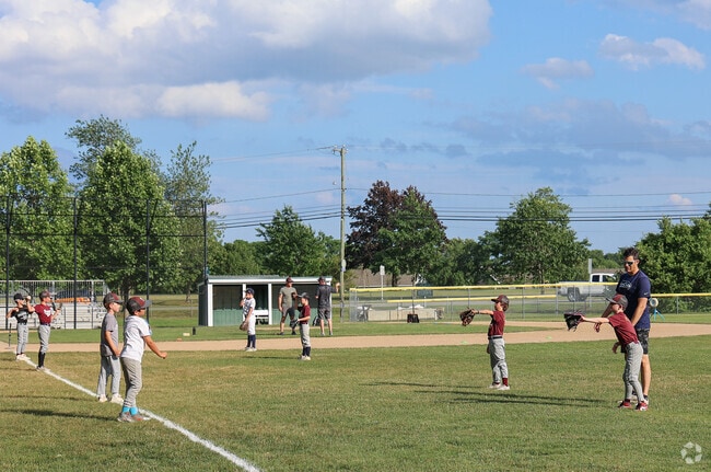 Portsmouth Plains Playground comes alive with the spirit of baseball, featuring themed play structures and open space that capture the energy of the game for kids and families alike.
