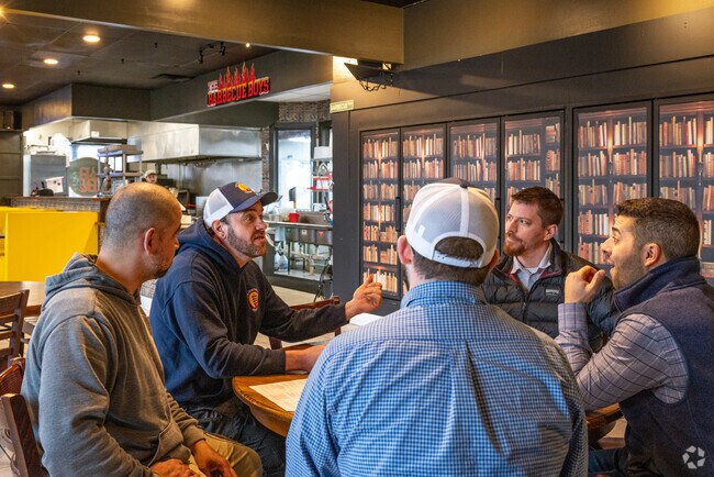 A group of diners settle around a table at The Barbecue Boys, Phillipsburg's premier BBQ joint.