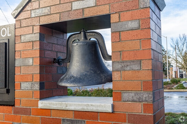 A vintage school bag is built into the sign at Harney Elementary School in Vancouver, WA.