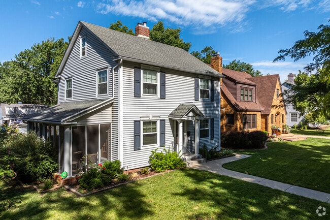 Some homes in Randolph have side porches that are screened in and shaded by large oaks.