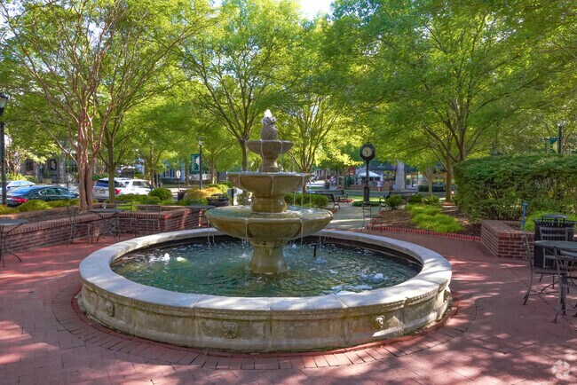 Locals can sit and relax around the fountain at Springmaid Park in Baxter Village.