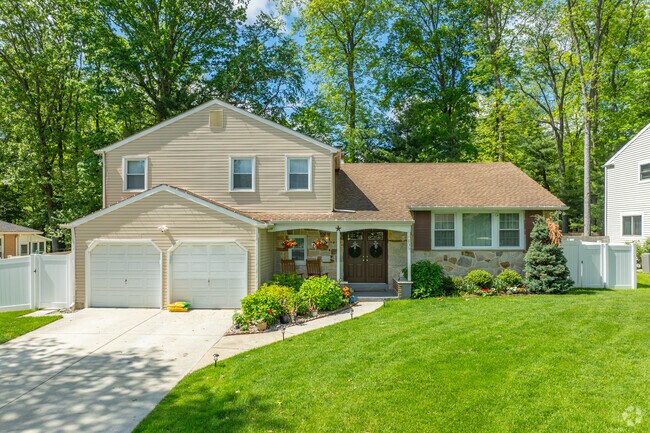 Split level homes in Greentree often have covered front porches to cool off under hot summer days.