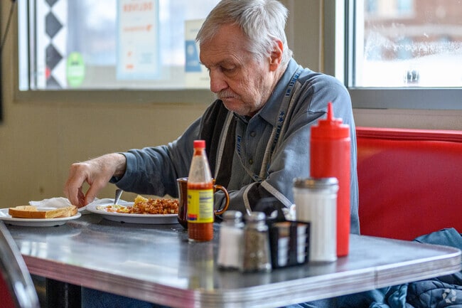 A young man enjoys a good meal at Fleetwood Diner in Greencroft Park.