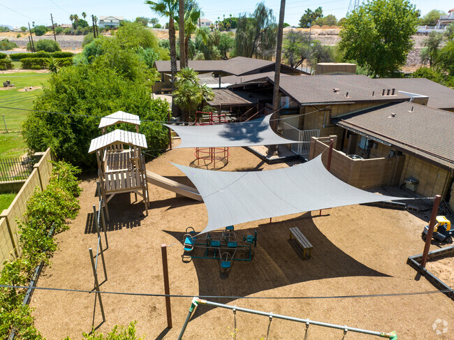 Lehi Montessori offers shaded play areas for the students.