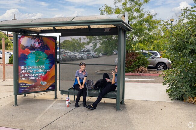 Workers in Blackstone wait for the bus together.
