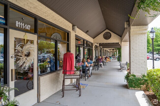 Shops at Stonehenge Market feature outdoor seating and boutique displays.