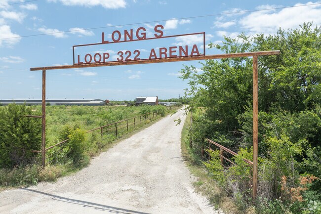 Arena events and wide pastures give Airport Loop 322 neighborhood its Texas western flair.