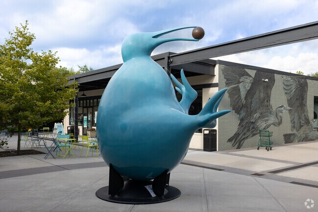 The bird sculpture stands tall, embodying the spirit of wildlife in Pound Ridge.