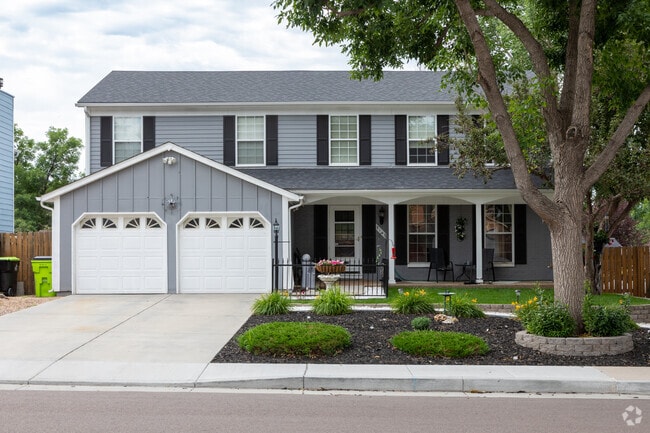 This two story home in Old Farm features a two car garage and amazing landscaping.