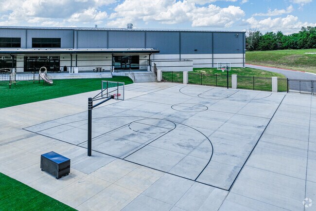 Some John Colbert Middle School students play basketball.