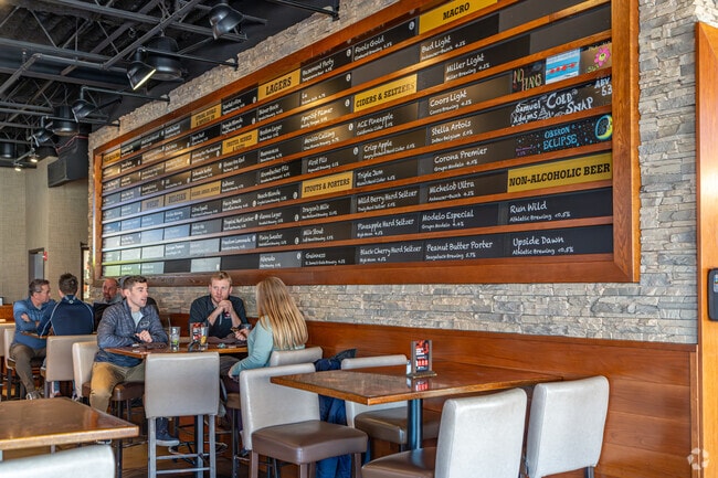 Old Tour Pour House features hefty food portions and over 90 beers on tap.