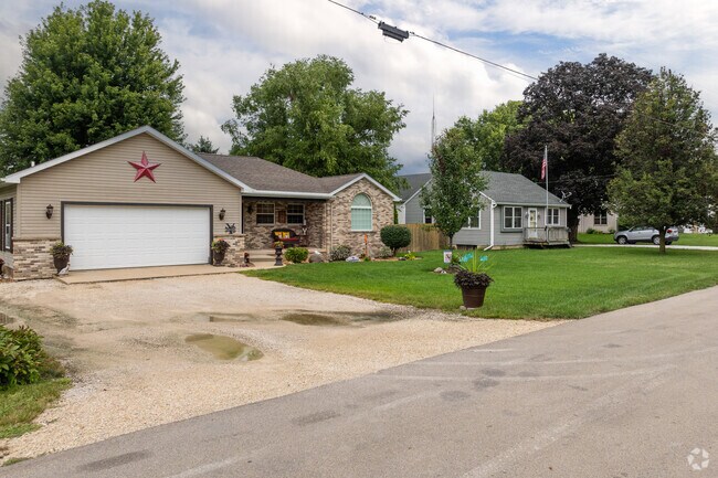 Homes in Sheridan often feature neat front lawns and mature trees.
