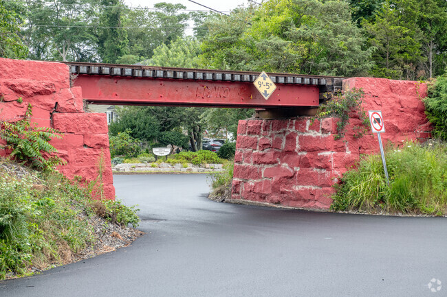 The railroad bridge at the entrance  to the Common Fence Point neighborhood is painted in red.