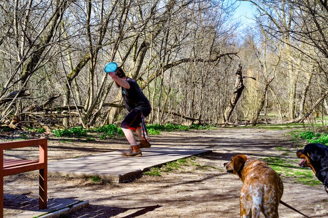 The disc golf course at Grand Wood Park draws active residents from across Waverly.