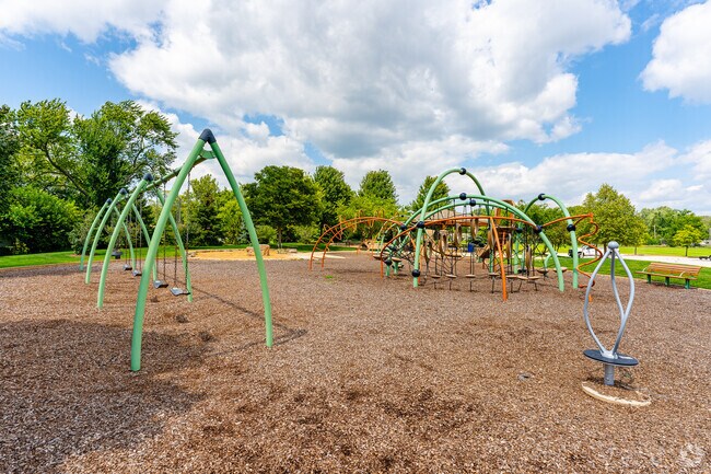 Aurora's New Haven Park features a well maintained playground, baseball fields, and paved paths.