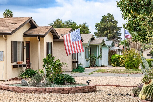Valle Hermosa features compact bungalows with manicured yards.