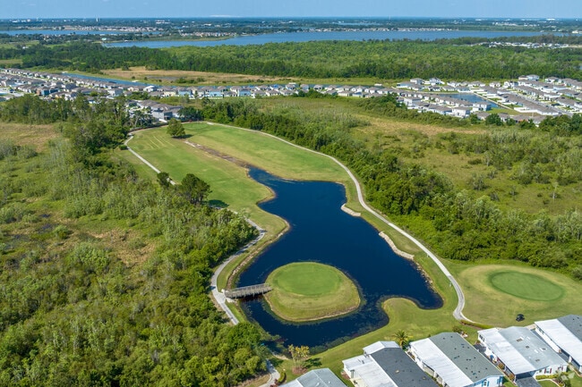 Test your skill on the island 4th hole at Four Lakes Golf Club.