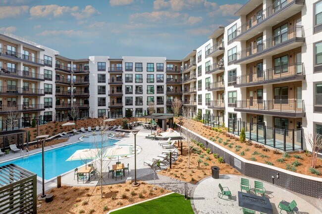 Resort-style Swimming Pool with Tanning Ledge Cabanas and Sundeck