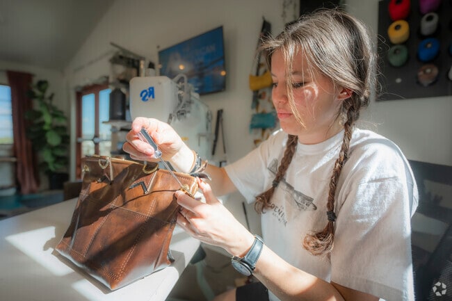 Tucked inside historic walls, the leather artisans at Bucking Horse, Colorado’s Jessup Farm blend timeless craft with modern design—each stitch a nod to the past, every piece a handcrafted story of heritage, durability, and western spirit.