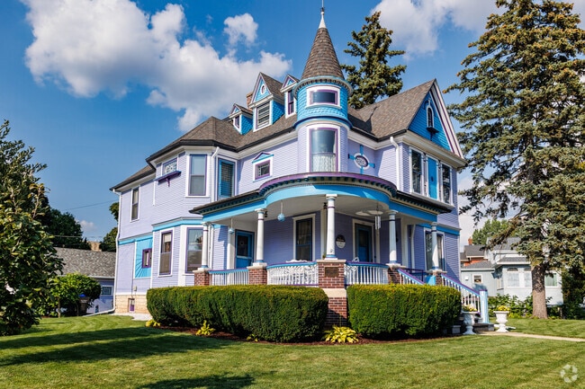 A brightly painted Queen Anne home sits on a corner lot in Old Third Ward.