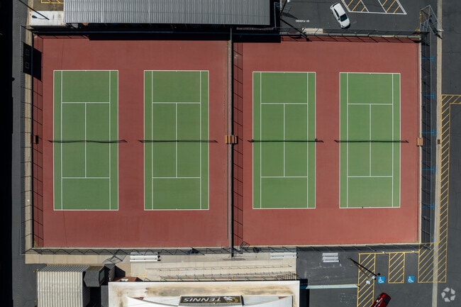 Green and red tennis courts at Highland High School.