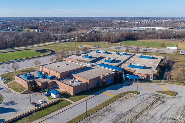 Discovery Middle School is surrounded by greenery and trees.