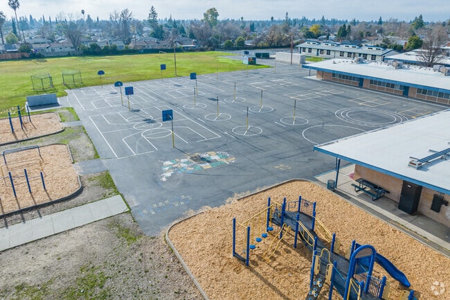 Play basketball at Coyle Avenue Elementary School.
