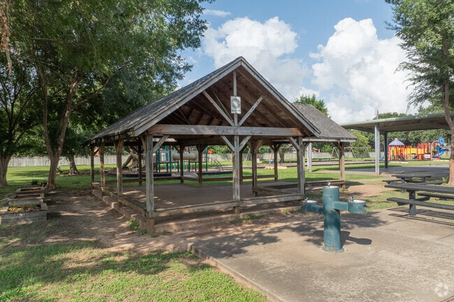 The campus includes outdoor play areas and a learning garden.