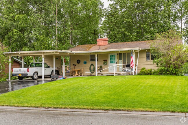 Ranch-style homes in Spenard sometimes boast modest carports to protect vehicles from the rain.