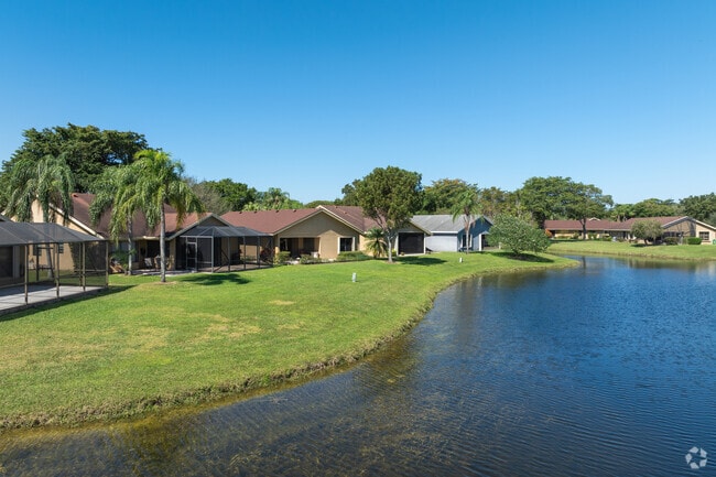 Discover waterfront charm in Coral Gate's row of homes.