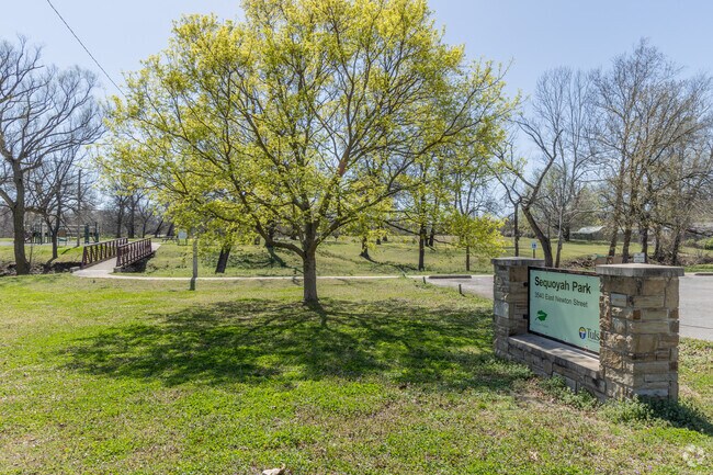 Sequoyah Park is a serene family getaway with a long walking path and playground.