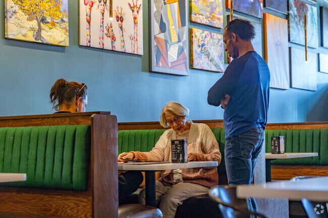 The Red Door Grill offers fine dining in a art decorated environment in Livingston Park.