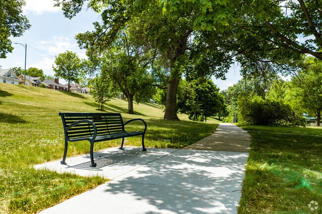 Bemis Park offers shaded paths and a playground near Orchard Hill.