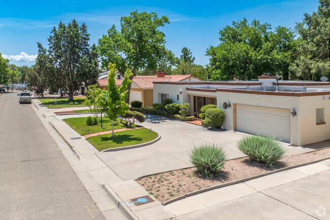 Single-family homes come in various styles in Huning Castle, including adobe and Spanish Revival.