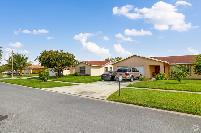 Picturesque homes lining the streets of Palm Beach Lakes.