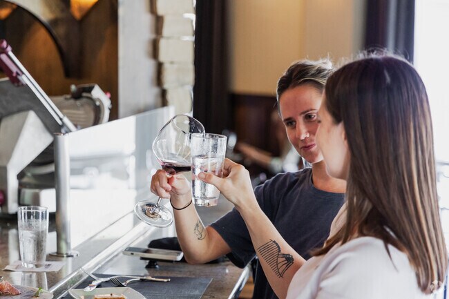 Oyster Point locals enjoy a delicious meal and a fine glass of wine at Opal Restaurant & Bar.