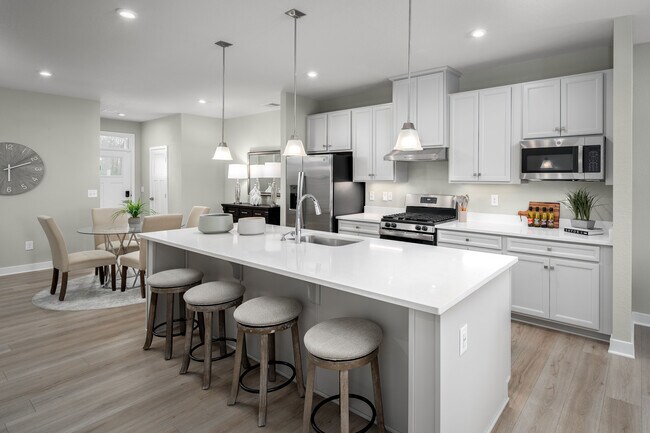 You won’t have to break the bank to build your dream home – luxury options like quartz countertops and luxury vinyl plank flooring are already included! Visit to see what else is included.