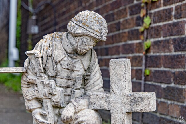 Residents of Hooverson Heights pay tribute to the military with lawn decor.