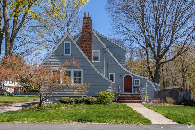 This charming home in East Braintree greets you with a brilliant red door.