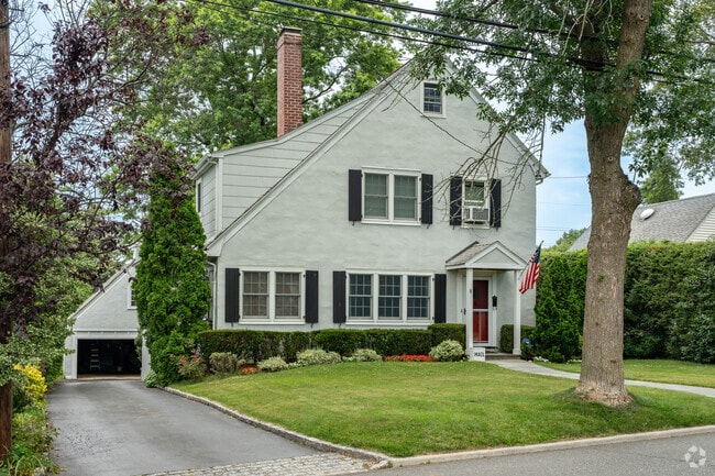 Colonial revival home with front-gabled roofing.