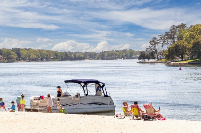 Boaters gracefully navigate the serene waters of First Landing State Park by Chic's Beach.
