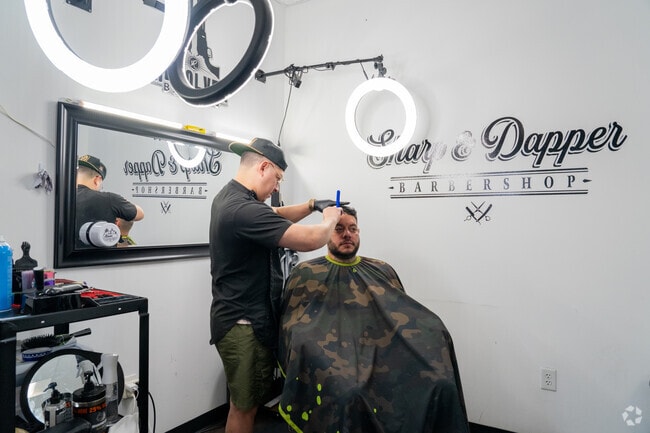Dunham Pointe locals freshen up with stylish cuts at Sharp & Dapper Barbershop.