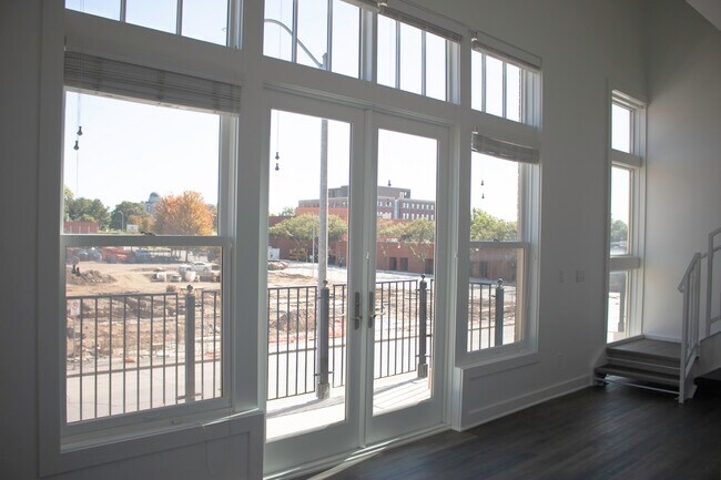 Large windows leading to private balcony